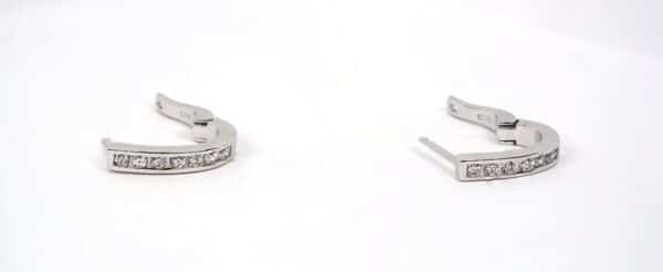 Sparkling Sterling Silver Huggie Earrings Adorned with Zircon Stones - Image 2