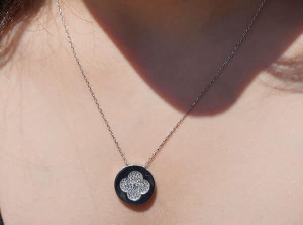 Sterling Silver Circle Necklace with Intricate Flower Design and Zircon Stone Accents