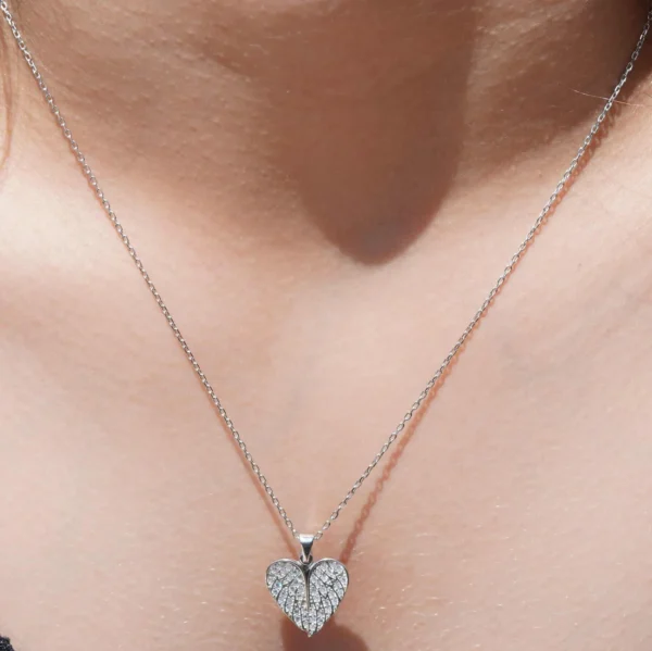 Sterling Silver Necklace with Heart-Shaped Wings and Sparkling Cubic Zircon Stones on Silver Background - Image 4