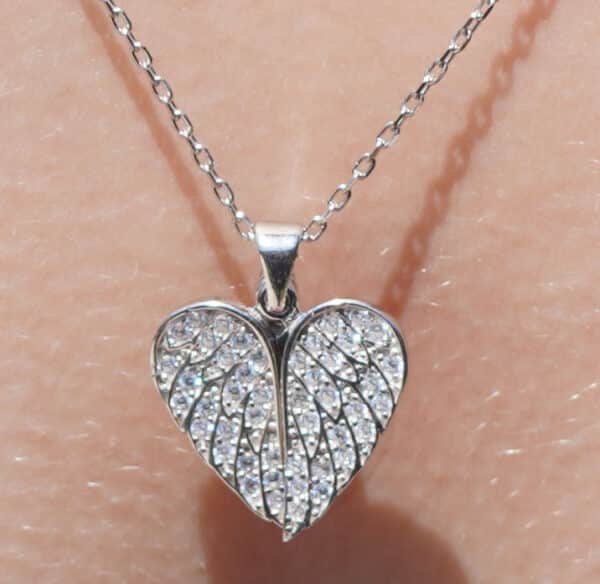 Sterling Silver Necklace with Heart-Shaped Wings and Sparkling Cubic Zircon Stones on Silver Background - Image 3