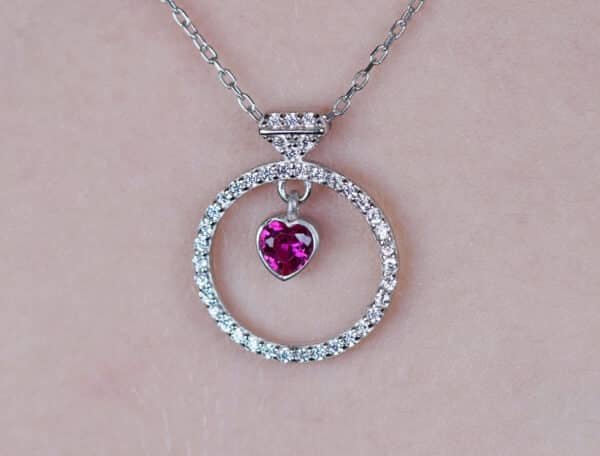 Stunning Sterling Silver Necklace with Zircon-Studded Circle and Heart-Shaped Pink Gemstone Pendant - Image 2