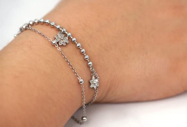 Flower-inspired Sterling Silver Bracelet with Zircon Stones and Polished Silver Beads