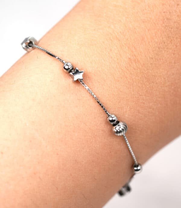Enchanting Sterling Silver Bracelet with Dancing Stars, Beads  Charms