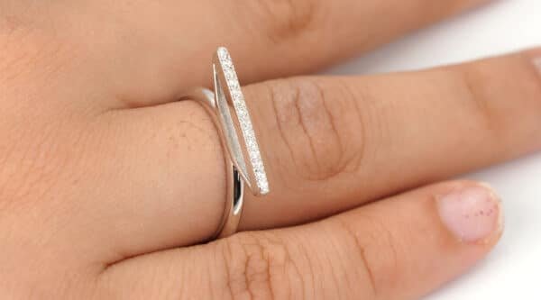 Sparkling Sterling Silver Ring with Elegant Zircon Stones and Unique Bulge Design