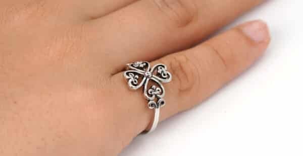 Contemporary Sterling Silver Ring with Interlocking Heart Design