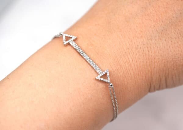 Zircon-Encrusted Sterling Silver Bracelet with Interlocking Arrow Design