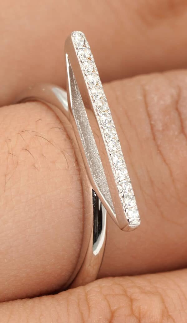 Sparkling Sterling Silver Ring with Elegant Zircon Stones and Unique Bulge Design - Image 4