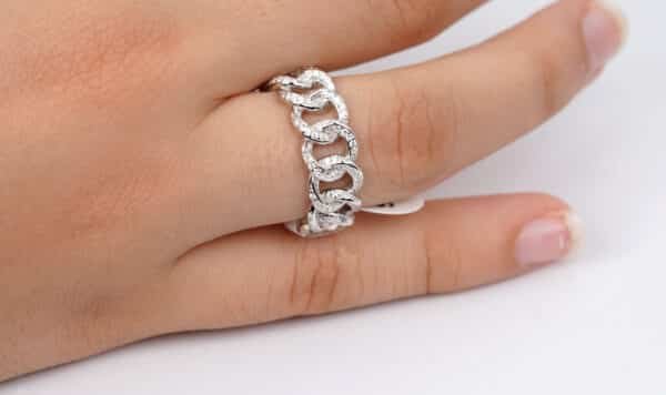 Sparkling Sterling Silver Ring with Zircon Stones and Free-Hanging Chain Design