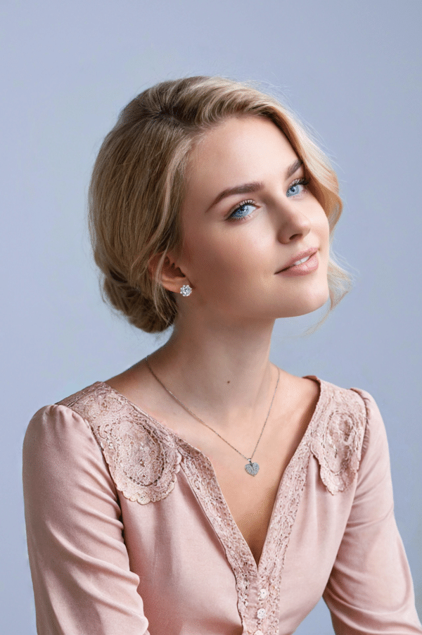 Sterling Silver Necklace with Heart-Shaped Wings and Sparkling Cubic Zircon Stones on Silver Background