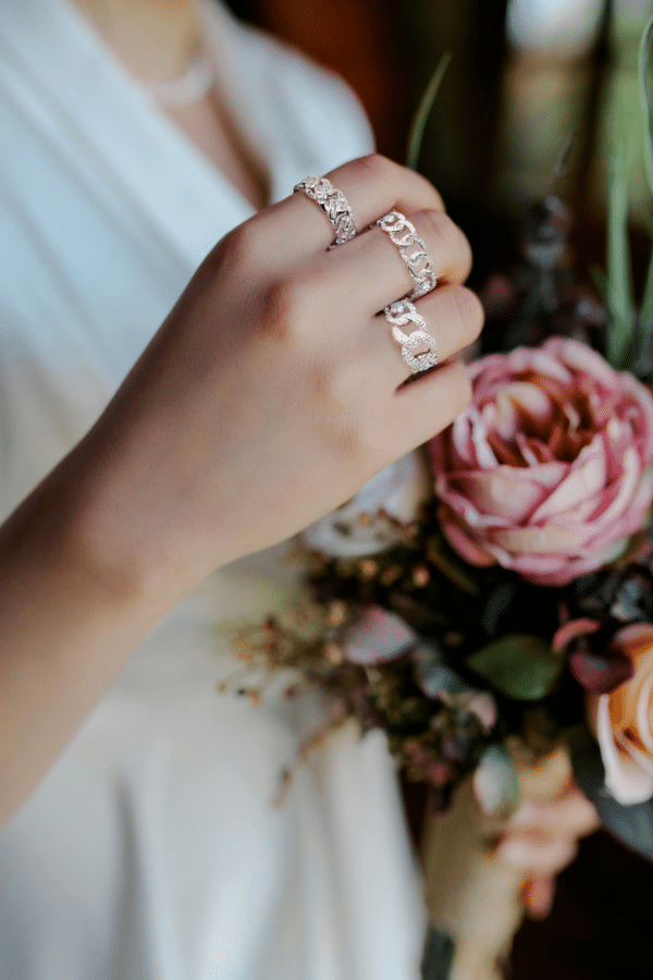Sparkling Sterling Silver Ring with Zircon Stones and Free-Hanging Chain Design - Image 2